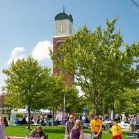 General shot of event containing employer booths and gvsu clock tower